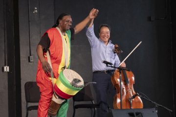 Yo-Yo Ma (right) performs with Kevin "Baba" Collins of the Kuungana African Drum and Dance Company of Flint. Photo by Lindsay Stoddard