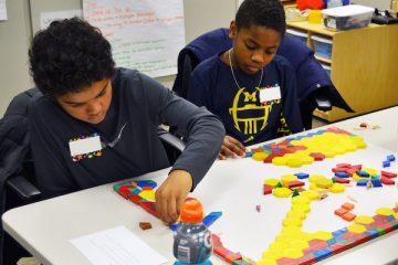 elementary students working on math games