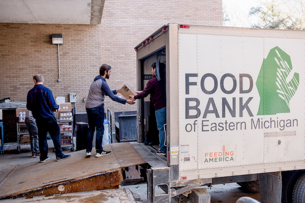 UM-Flint students unload food items from the Food Bank of Eastern Michigan