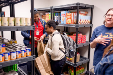 UM-Flint students organizing the student food pantry