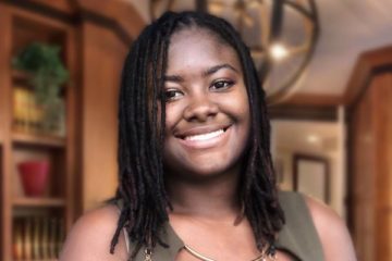 Georgina Brown, a UM-Flint student, smiles for a portrait.