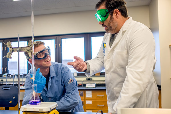 Green chemistry student Nicholas Wills works alongside associate professor Nick Kingsley, PhD.