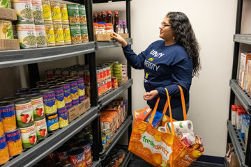 Adelina Gutierrez, a UM-Flint senior, volunteers at the Wolverine Food Den, a food pantry for students experiencing food insecurity.