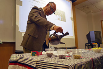 Dr. Guluma Gemeda pours coffee in an Ethiopian coffee ceremony as a part of Africa Week 2020 at UM-Flint.