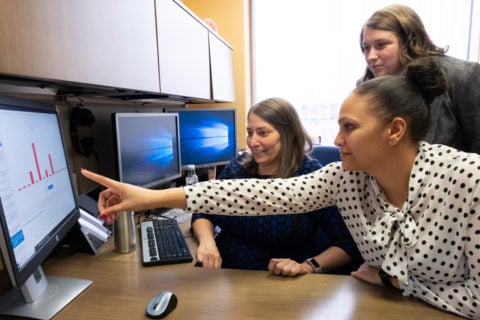 Public Health and Health Sciences professor Michelle Sahli, left, with Master of Public Health students Anya Harris, right, and Caitlin Tosh, top. (Photo by Lindsay Stoddard, University Communications & Marketing)