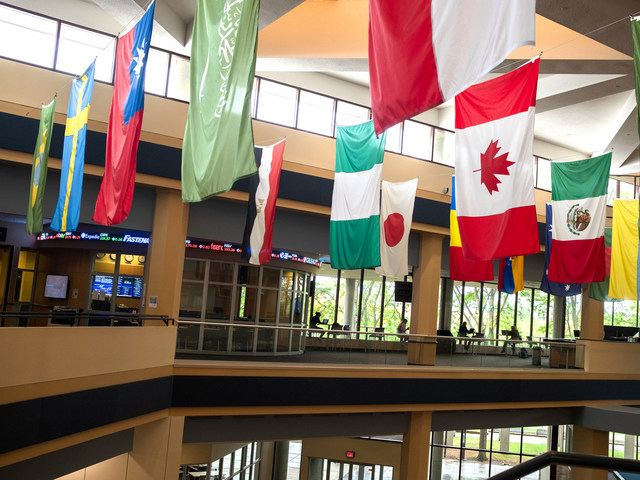 Flags from several nations hang in the University of Michigan-Flint's Riverfront Center. (