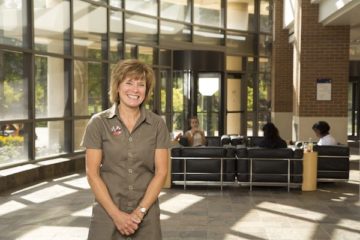 Maureen Tippen poses for a portrait in the lobby of the White Building at UM-Flint.