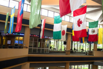 Flags of various nations hang in the Riverfront Residence Hall