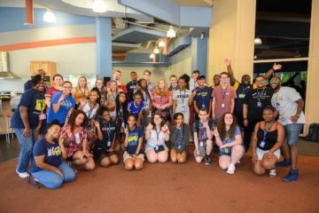 A group of 32 EOI students and staff pose for a photo as part of the EOI Summer Bridge Program.