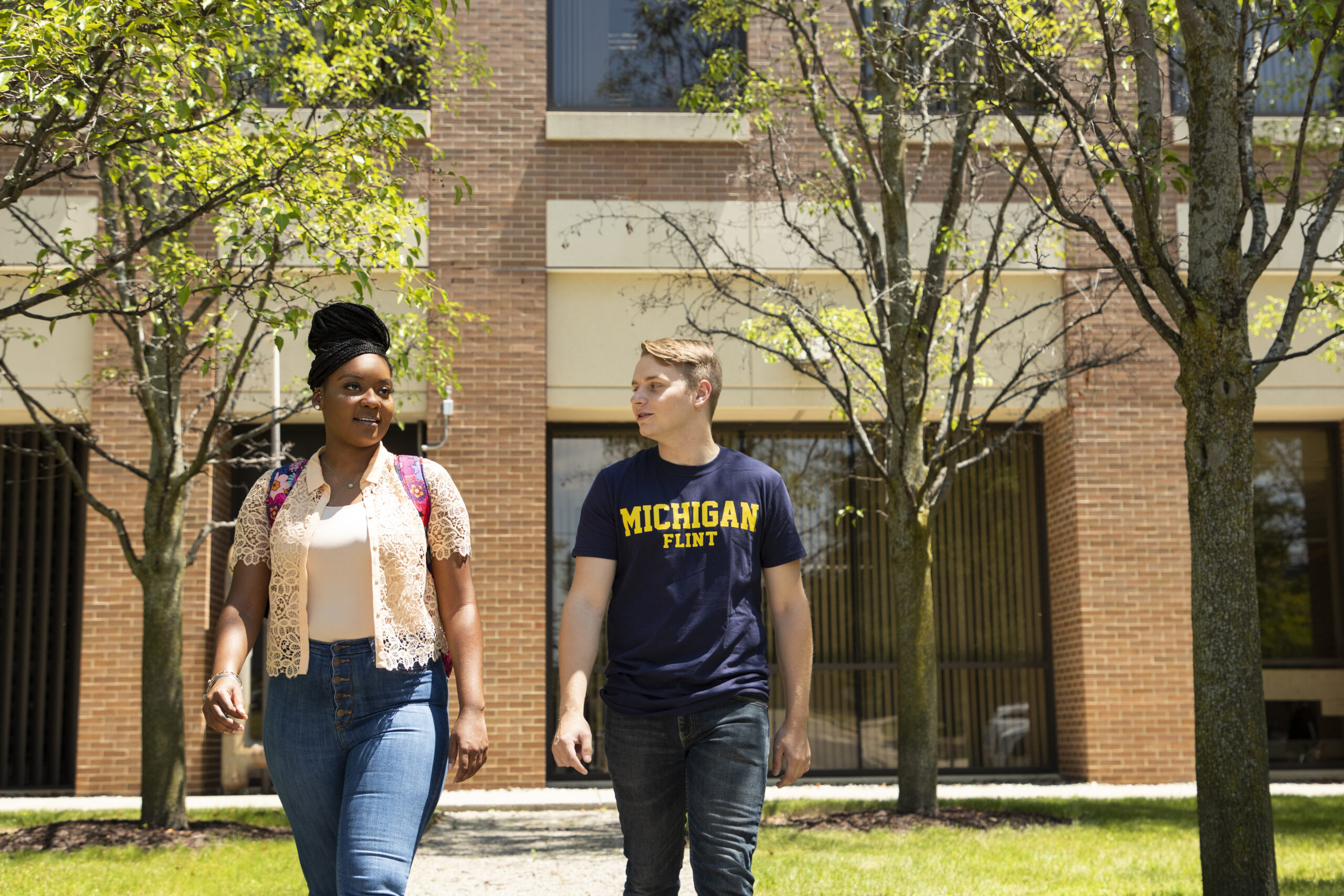 Students walking outside of the White Building