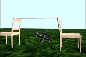 A gray drone flies underneath a rope held up by two chairs as part of an obstacle course.