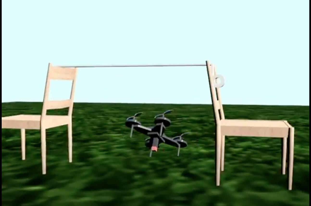 A gray drone flies underneath a rope held up by two chairs as part of an obstacle course.