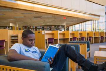 A student reading in the library