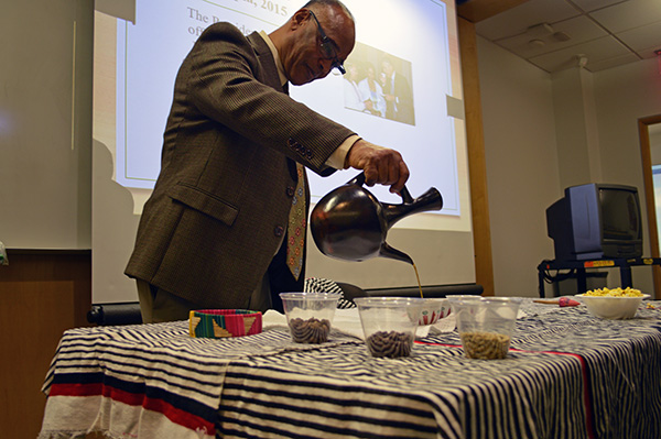 A photo of Guluma Gemeda pouring traditional coffee. 