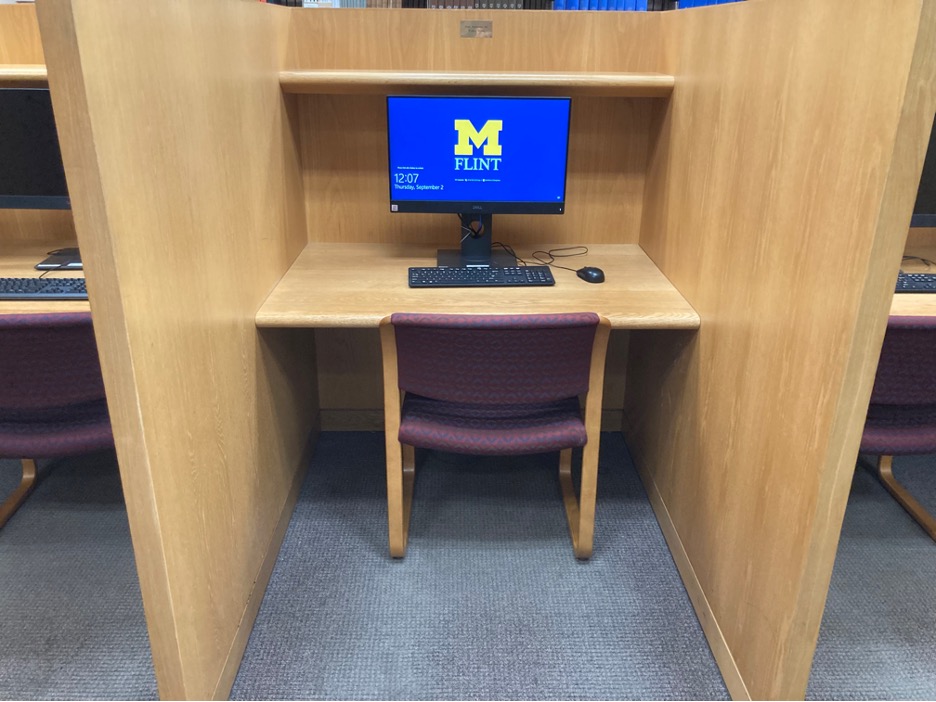 A computer in a study cubbie