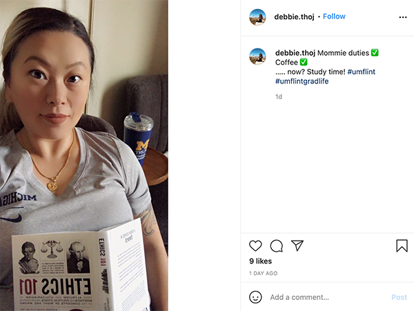 a woman sitting with a textbook