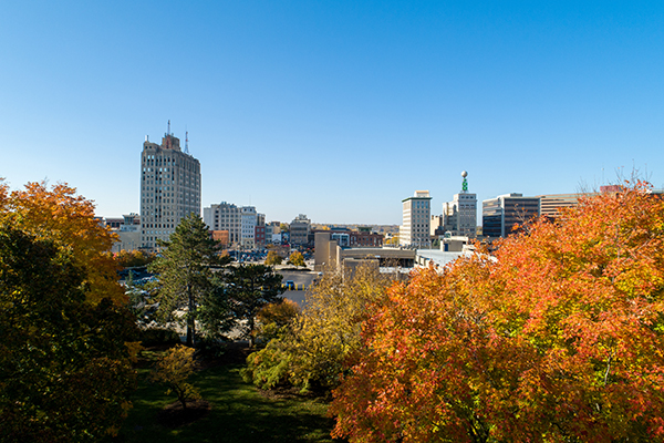 An aerial view of Flint and campus showing fall colors on trees