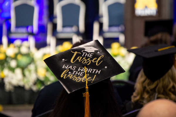 Decorated graduation cap with text: The tassel was worth the hasle! 