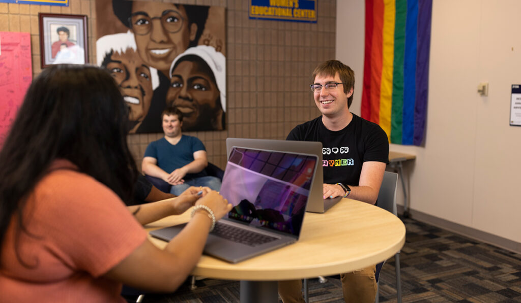 Three UM-Flint students sitting together in the Center for Gender and Sexuality space