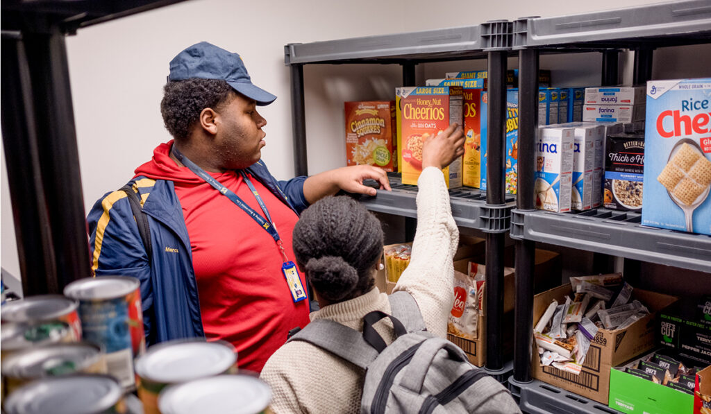 Two UM-Flint students browsing food item in the Wolverine Food Den