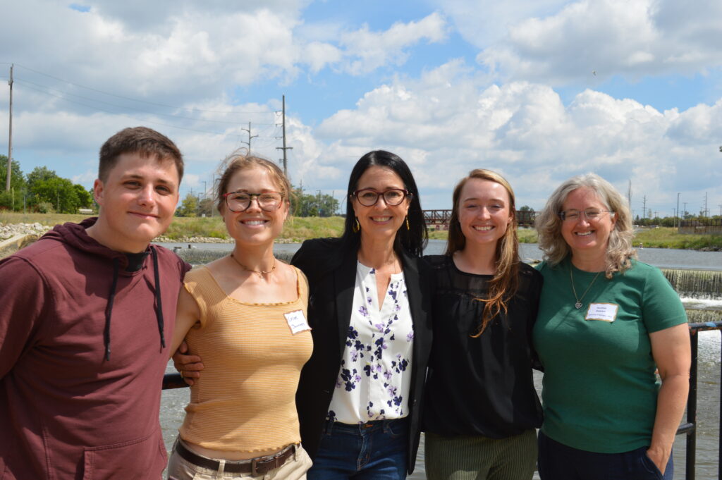  Maxwell Buxton, Chloe Summers, Shannon Estenoz, Arianna Elkins and Dr. Heather Dawson posed for a photo in front of the last remaining pieces of the Hamilton Dam Thursday. (Photo Credit: Madeline Campbell) 