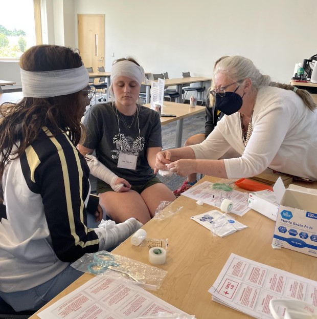 Summer Campers learn critical Stop the Bleed tactics for lifesaving skills.