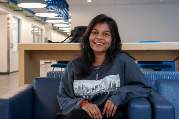 Amanda Binu sitting in the CIT lobby