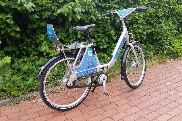 An electric bicycle on a brick pathway