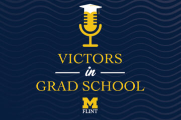 A graphic of a microphone with a graduation cap and the text Victors in Grad School with the UM-Flint stamp