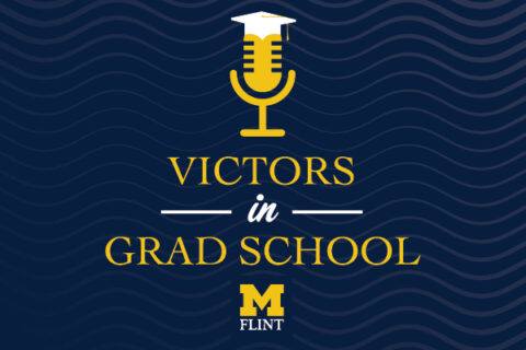 A graphic of a microphone with a graduation cap and the text Victors in Grad School with the UM-Flint stamp