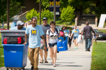 Students moving in to First Street Residence Hall