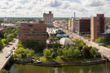 An aerial view of the Flint river and the Flint cityscape