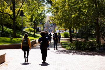 Students walking outside on the UM-Flint campus