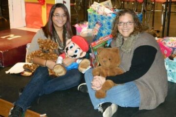 UM-Flint student Kennedy Carter poses with toys she collected for kids at Children's Hospital of Michigan