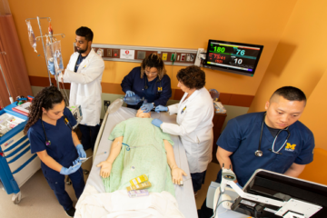 UM-Flint nursing students work with a simulated patient in the School of Nursing simulation lab