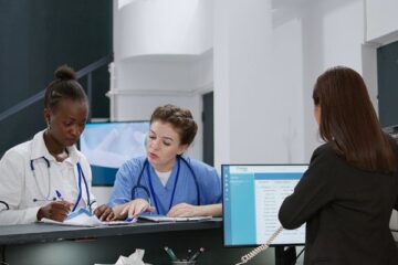 Health services administrators talk to each other in a hosptial