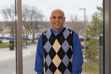 Dr. Khanafer standing in the CIT atrium.