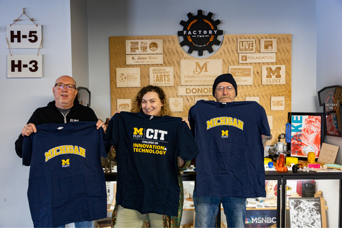 Employees at Factory Two showing their UM-Flint spirit.