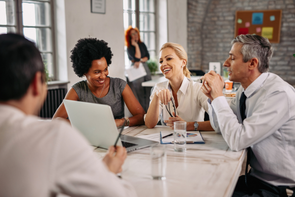 A photo of business professionals having a meeting