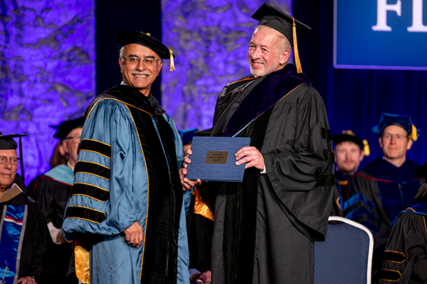 Dutta (left) presented Hagerman with an honorary Doctor of Laws Degree.