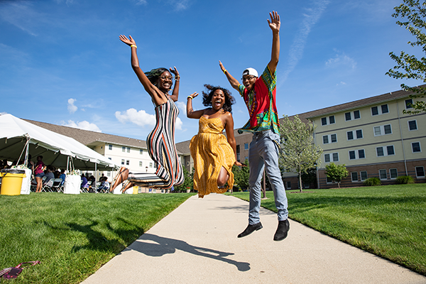 Students jumping for joy in summer