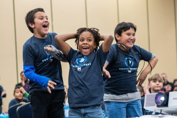 Students celebrating a win at a Young Sharks event