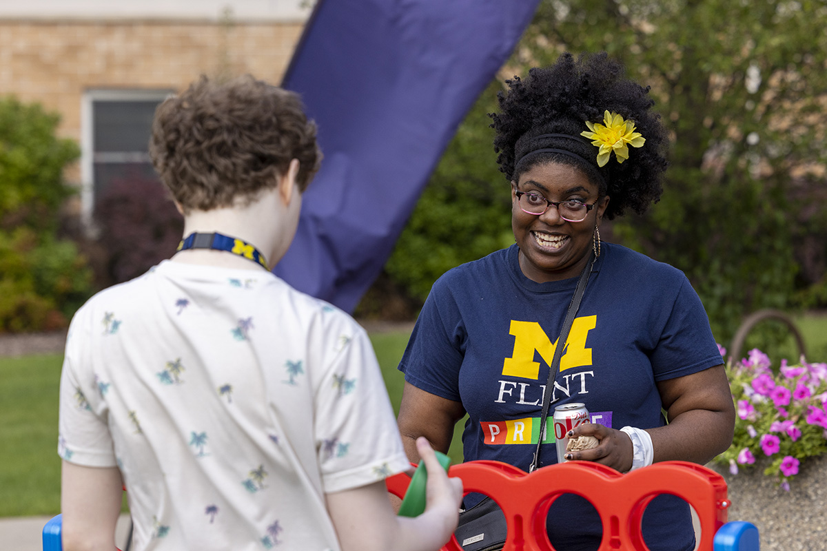 Two members of the UM-Flint community playing Connect 4.