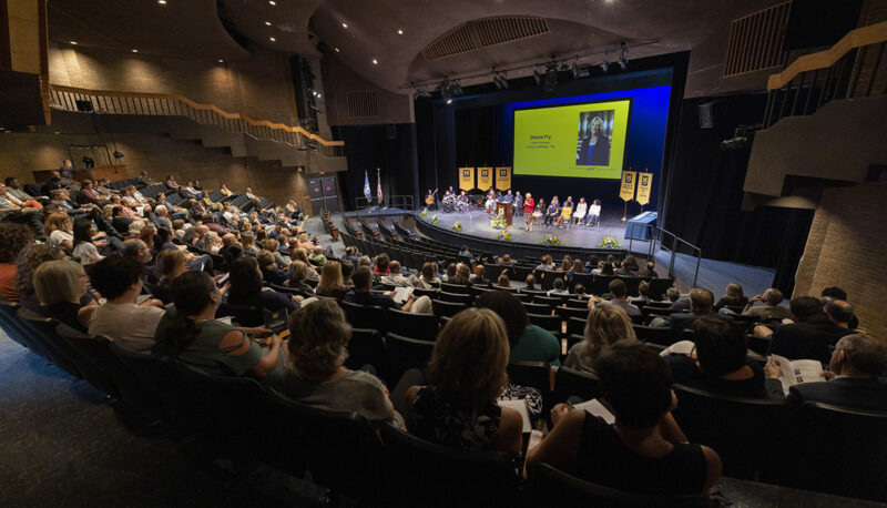 A wide shot of the crowd and stage at the Academic Convocation