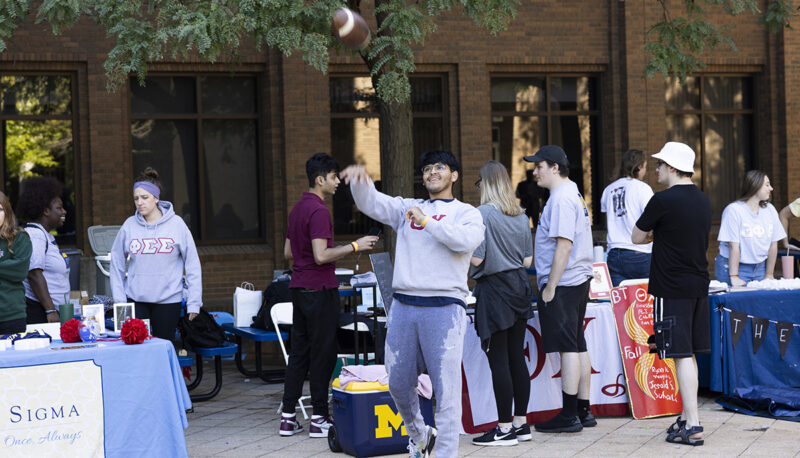 A student throwing a football