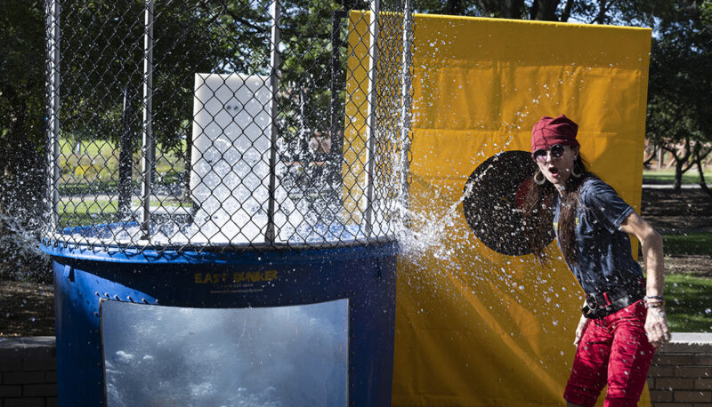 A professor dunking a student in a dunk tank