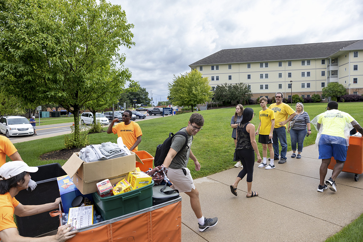 Students pulling items into First Street Residence Hal.