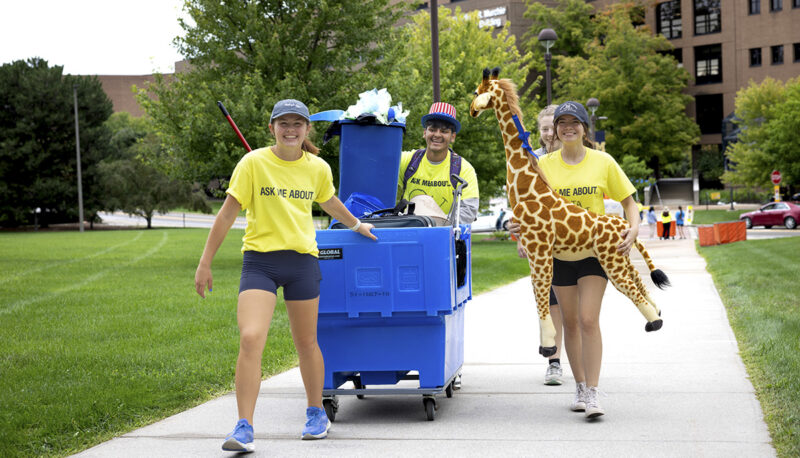 Students pulling items into First Street