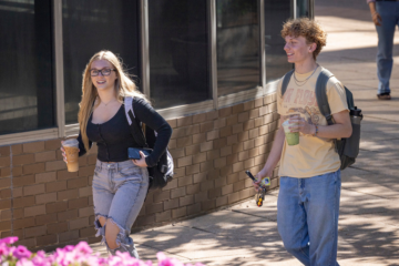 Two students walking on campus