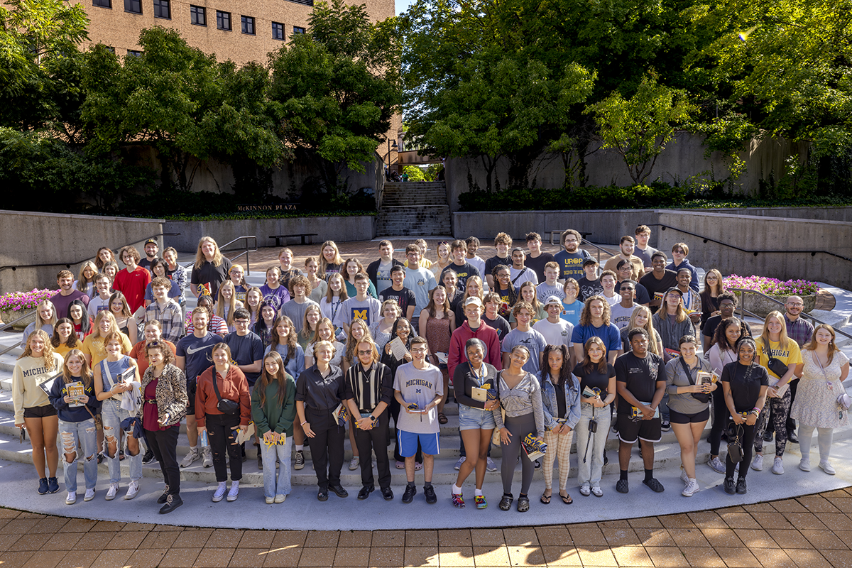 A large group of students posing in McKinnon Plaza